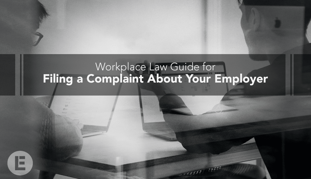 frustrated employee discussing with workmate Executive Law Group workplace law guide for filing a complaint about employers